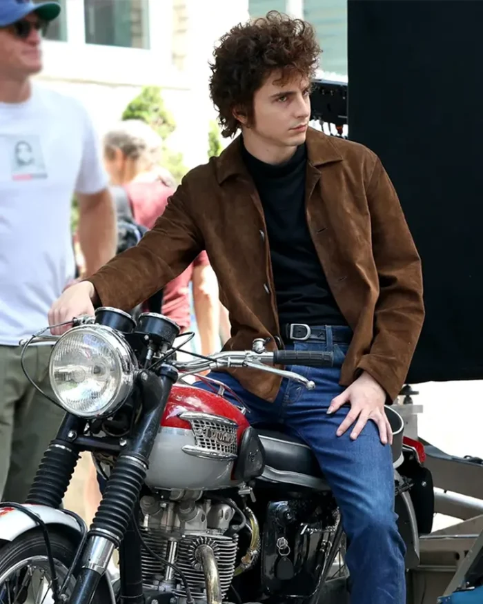 A Complete Unknown Timothée Chalamet Distressed Jacket Sitting On A Bike Look