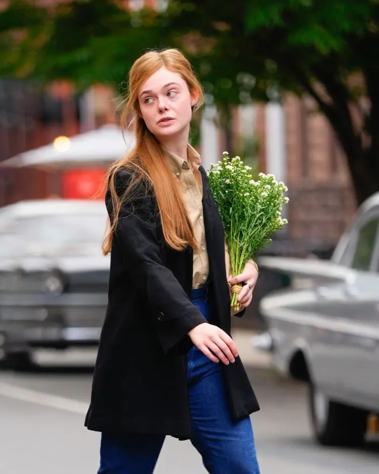 A Complete Unknown Elle Fanning Black Trench Coat Right Side Look