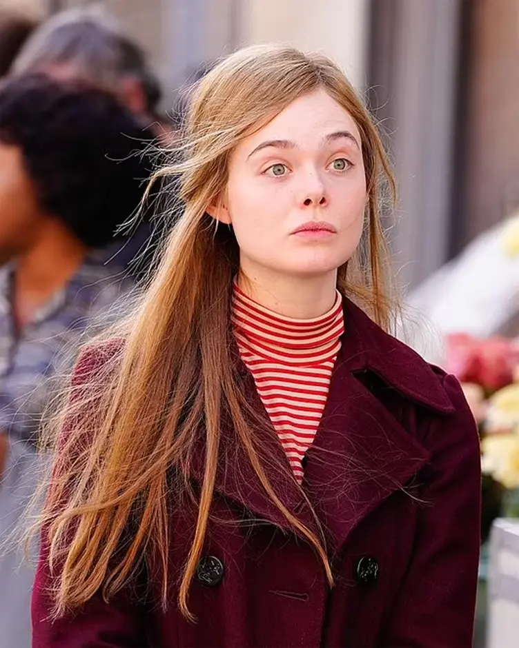 A Complete Unknown Elle Fanning Red Coat Front Closeup