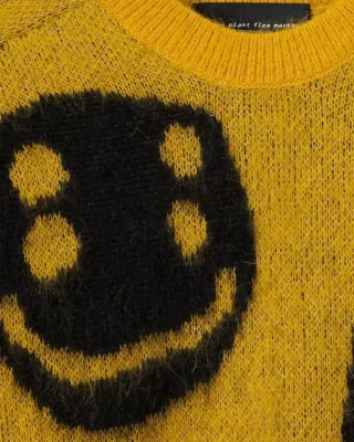 cactus plant flea market x smiley sweater close up